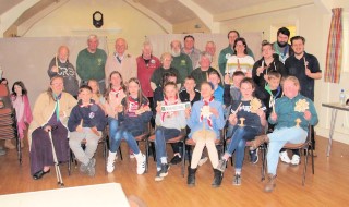 The group of scouts and leaders with club members at the back